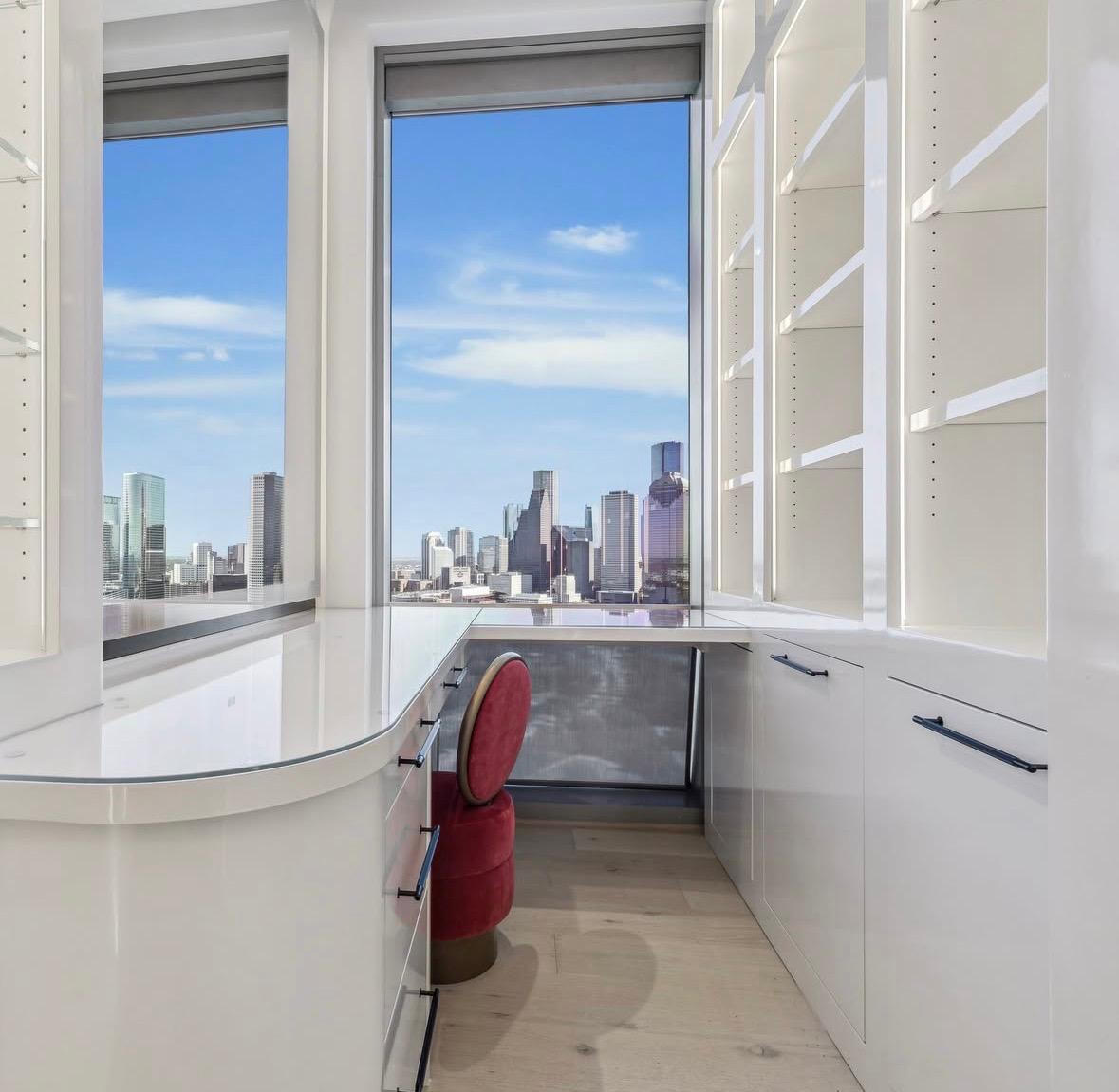 White vanity and dressing room overlooking the Houston skyline, The Residences at The Allen