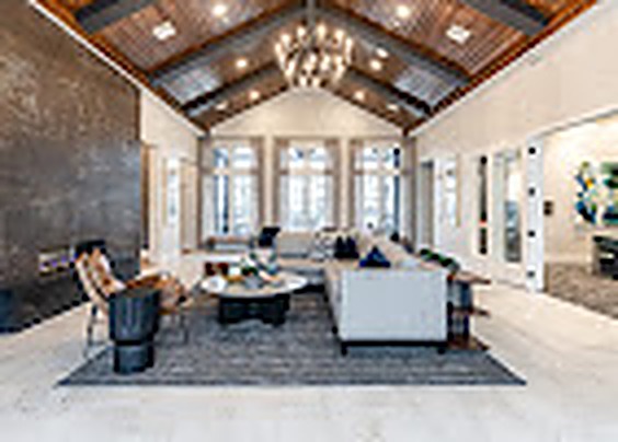 Vaulted great room with exposed beams and tall windows, Alexan Lake Olympia